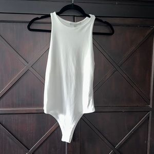 Gaze high neck sleeveless cream bodysuit.